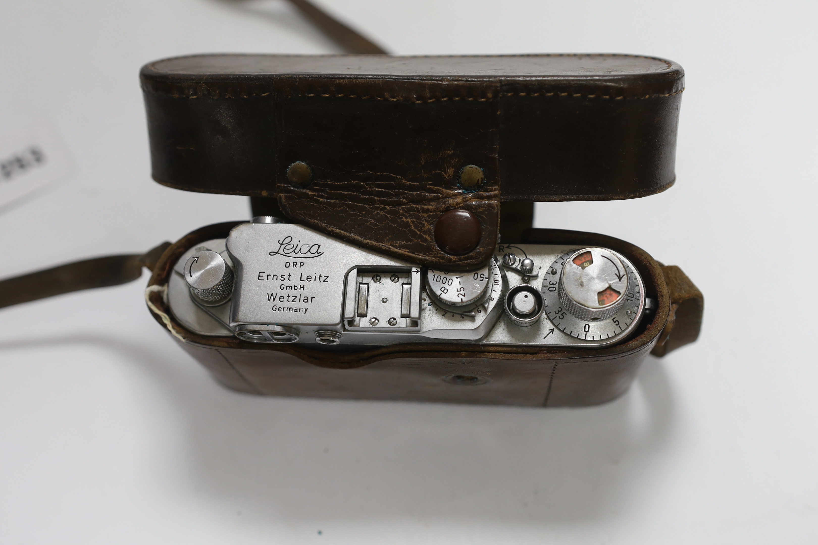 A Leica IIIf camera, Nr.646305, with summar f=5cm 1:2 lens, with leather case with strap